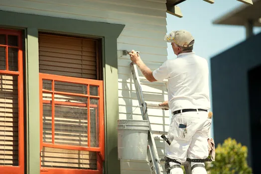 Painting siding and colorful trim on a North Ranch home
