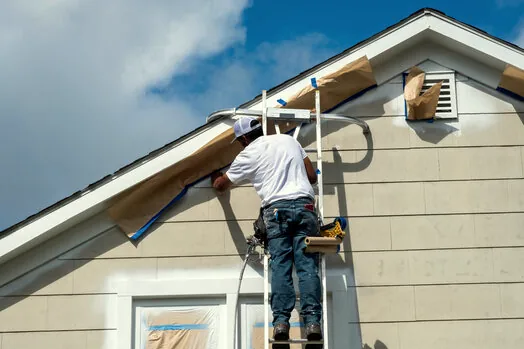 Masking an exterior on Westlake Island before painting